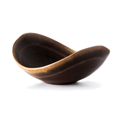 Black walnut bowl with natural live edge and dark finish, curved organic shape with light wood grain detail.