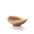 Cherry wood bowl with organic asymmetrical shape and natural live edge rim.