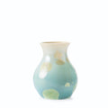 Jade-colored ceramic bud vase with crystalline glaze and organic cream and yellow accents throughout.