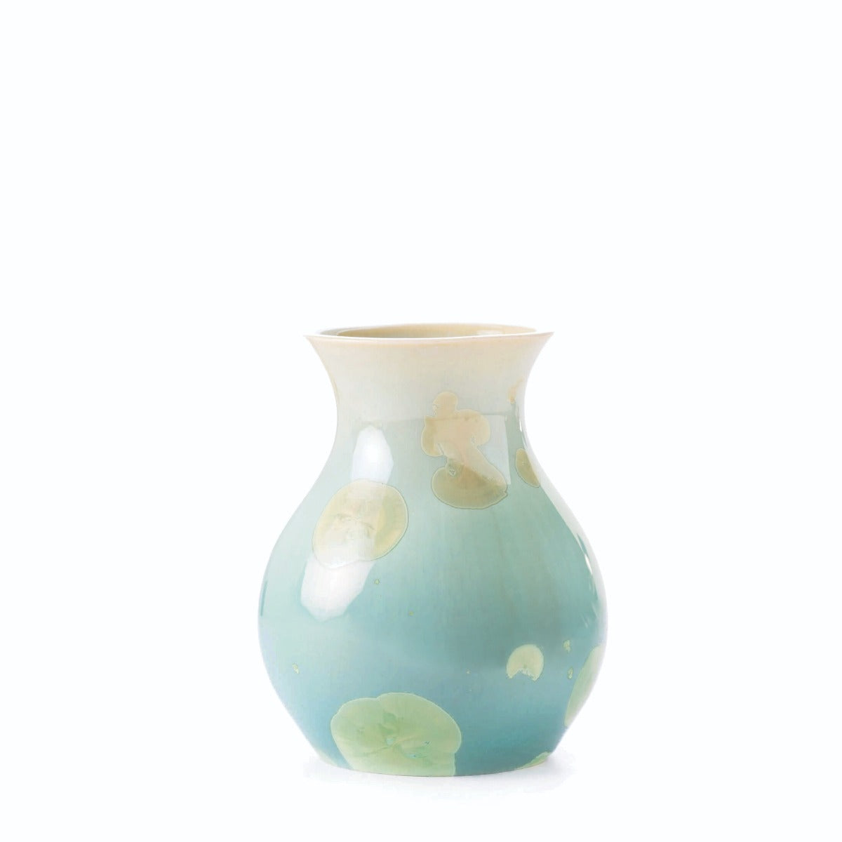 Jade-colored ceramic bud vase with crystalline glaze and organic cream and yellow accents throughout.