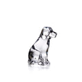 Clear glass dog figurine sitting upright with black detailing on head and body.