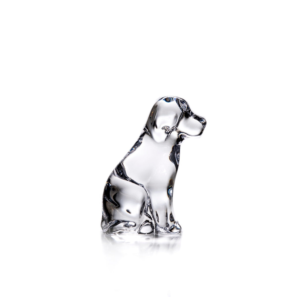 Clear glass dog figurine sitting upright with black detailing on head and body.
