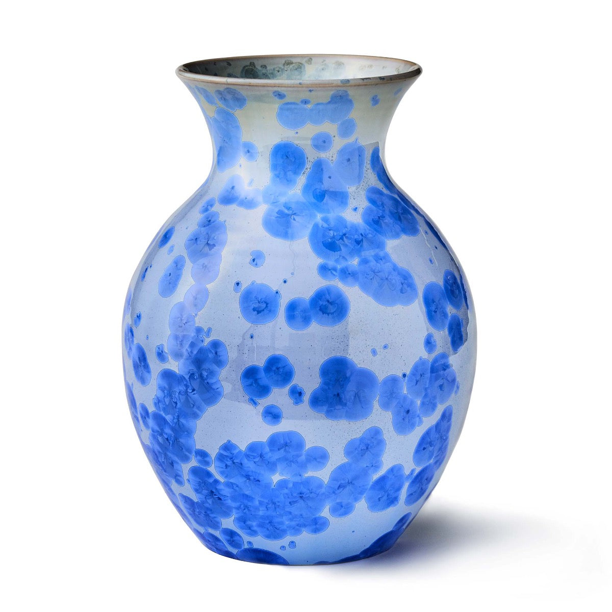 Cobalt blue crystalline vase with organic blob pattern on white glazed ceramic body, flared rim, rounded bulbous form.
