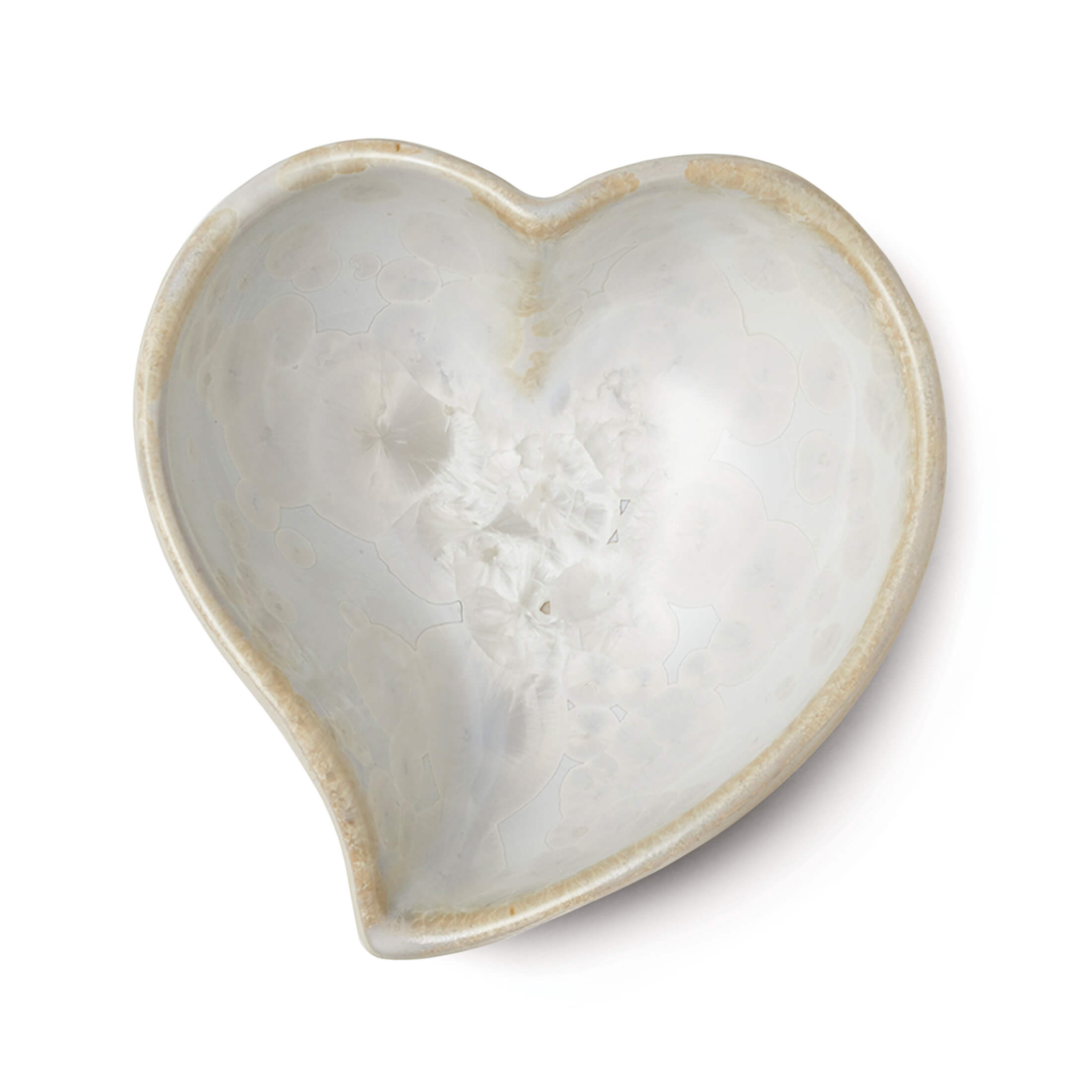 Heart-shaped bowl with crystalline white interior and tan-colored rim and exterior.