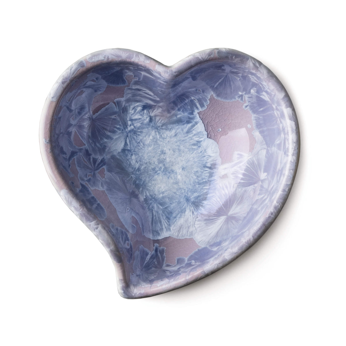 Heart-shaped crystalline bowl with blue and pink abstract floral pattern throughout interior.