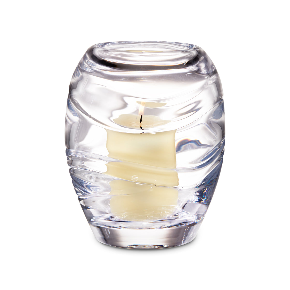 Clear glass hurricane candle holder with cream-colored pillar candle inside and ribbed detailing on exterior.