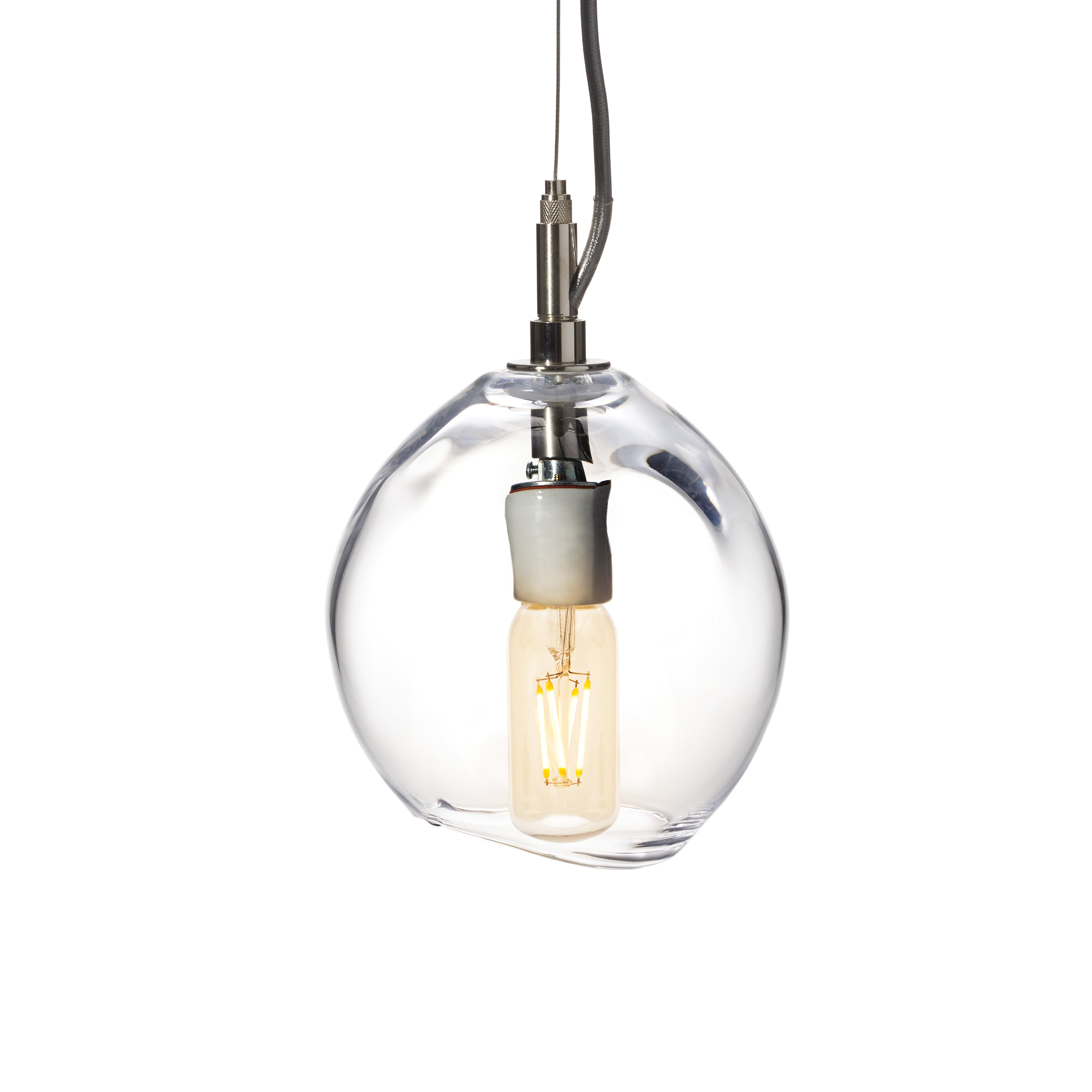 Clear glass globe pendant with exposed filament bulb and dark metal fixture suspended from black cord.