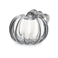 Clear glass pumpkin-shaped container with ridged sides and twisted stem handle.
