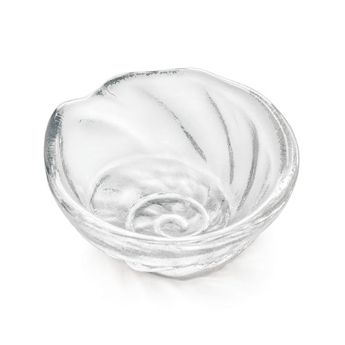 Small clear glass bowl with shell-shaped design and radiating ridges.