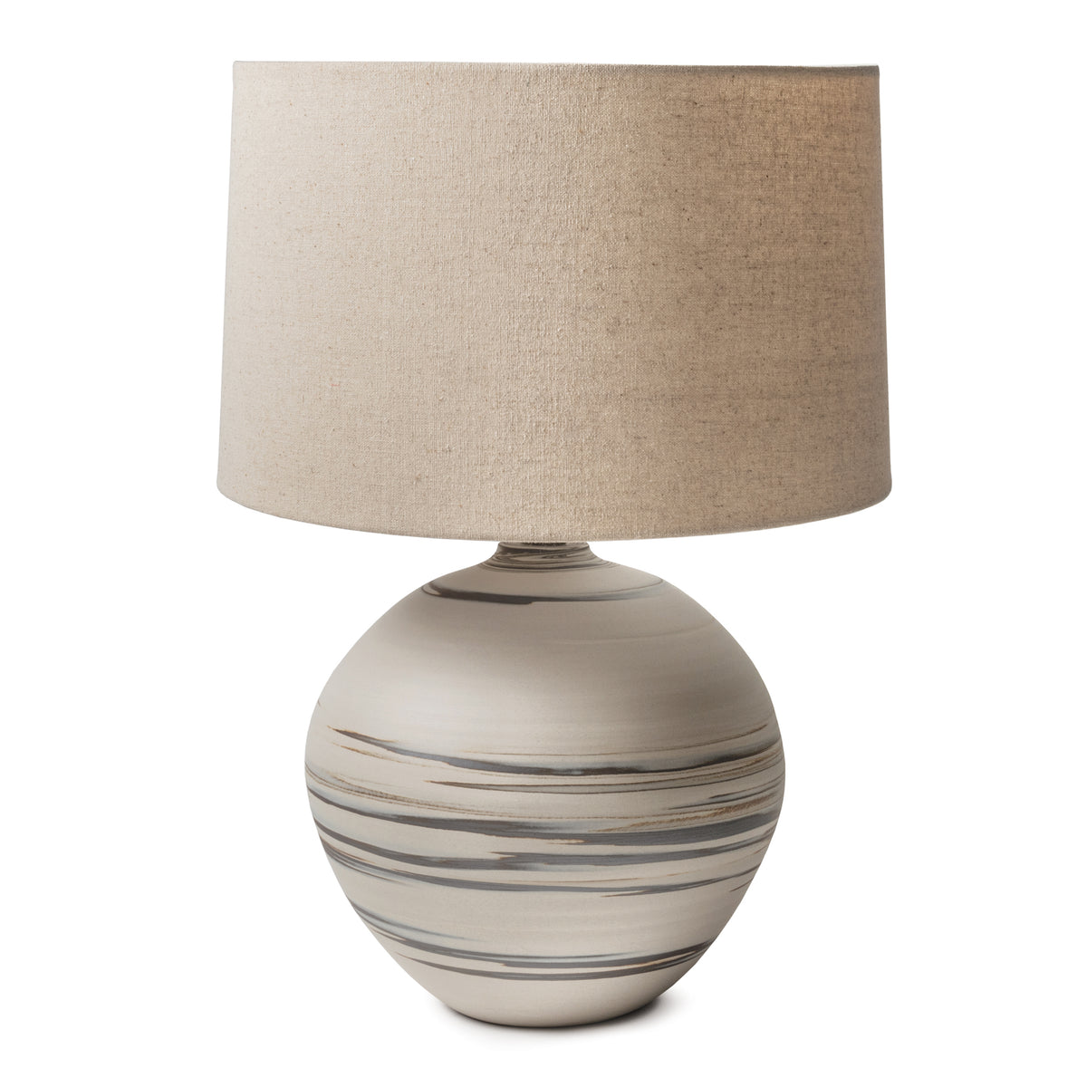 Round ceramic lamp with gray stripe pattern and beige linen drum shade.