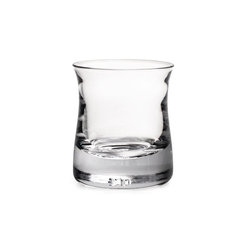 Clear glass tumbler with tapered sides and weighted base, suitable for whiskey or spirits.