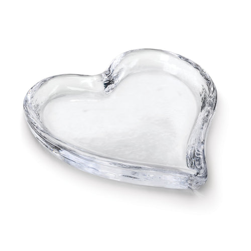 Clear glass tray shaped like a heart with a shallow well and raised edges.