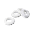 Four white marble napkin rings with smooth, rounded oval shapes arranged in a group.