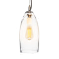 Clear glass pendant light with brushed metal fixture and exposed filament bulb suspended by dark cord.