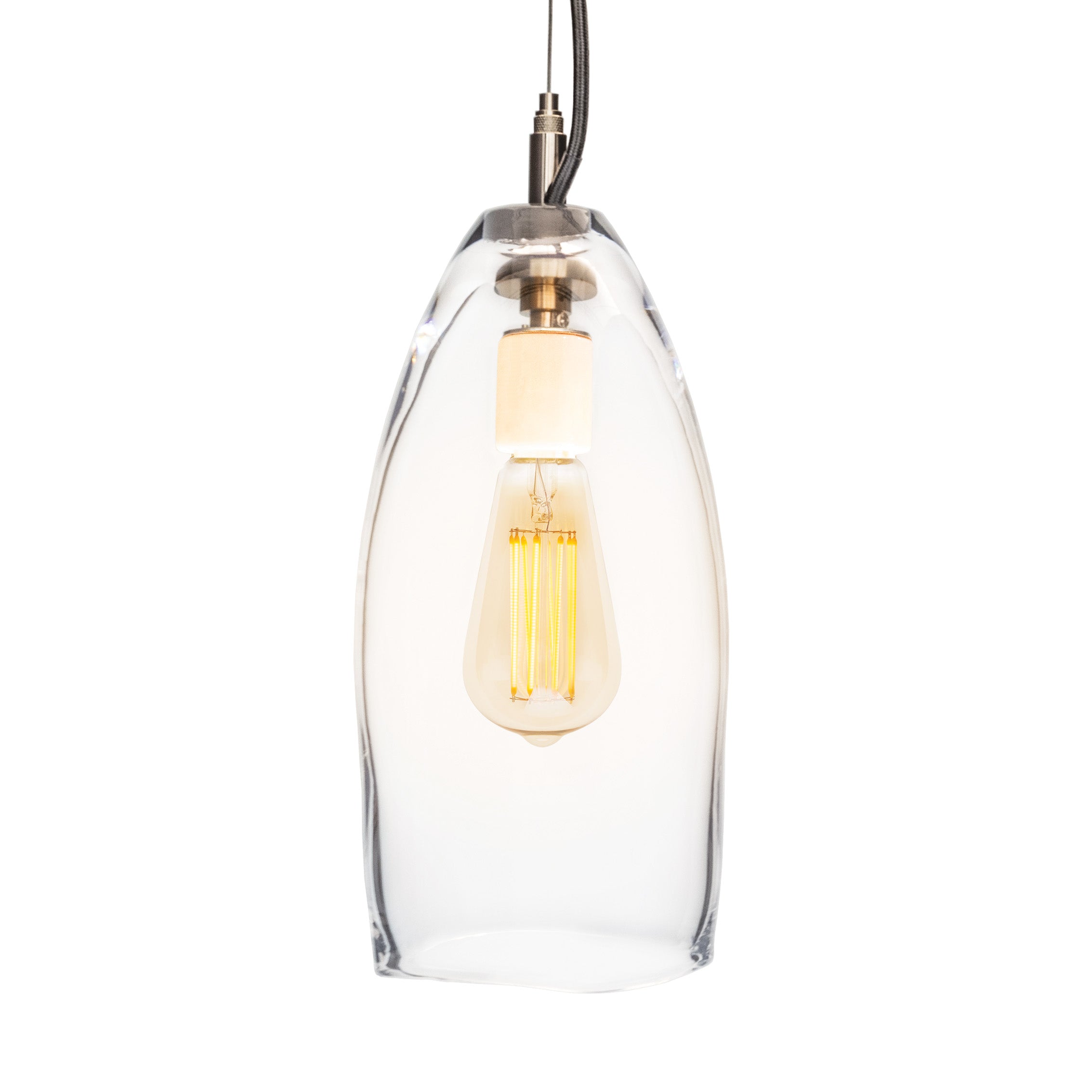 Clear glass pendant light with brushed metal fixture and exposed filament bulb suspended by dark cord.