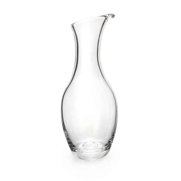 Clear glass carafe with curved sides and a pouring spout at the top.
