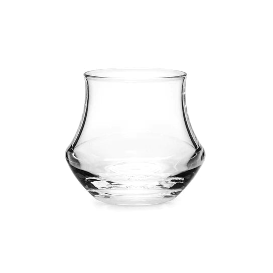 Clear glass whiskey tumbler with curved sides and a tapered top.