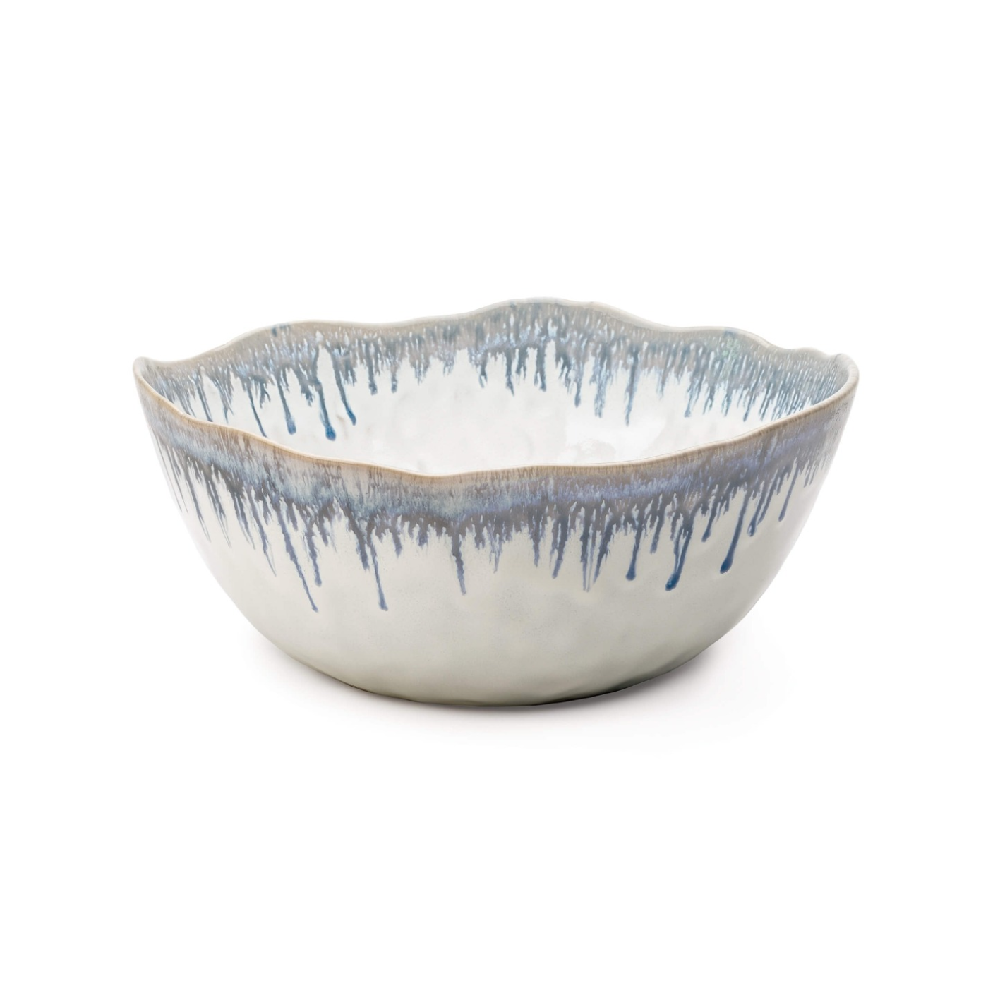 White ceramic serving bowl with blue drip pattern and wavy rim, natural tan edge detail.