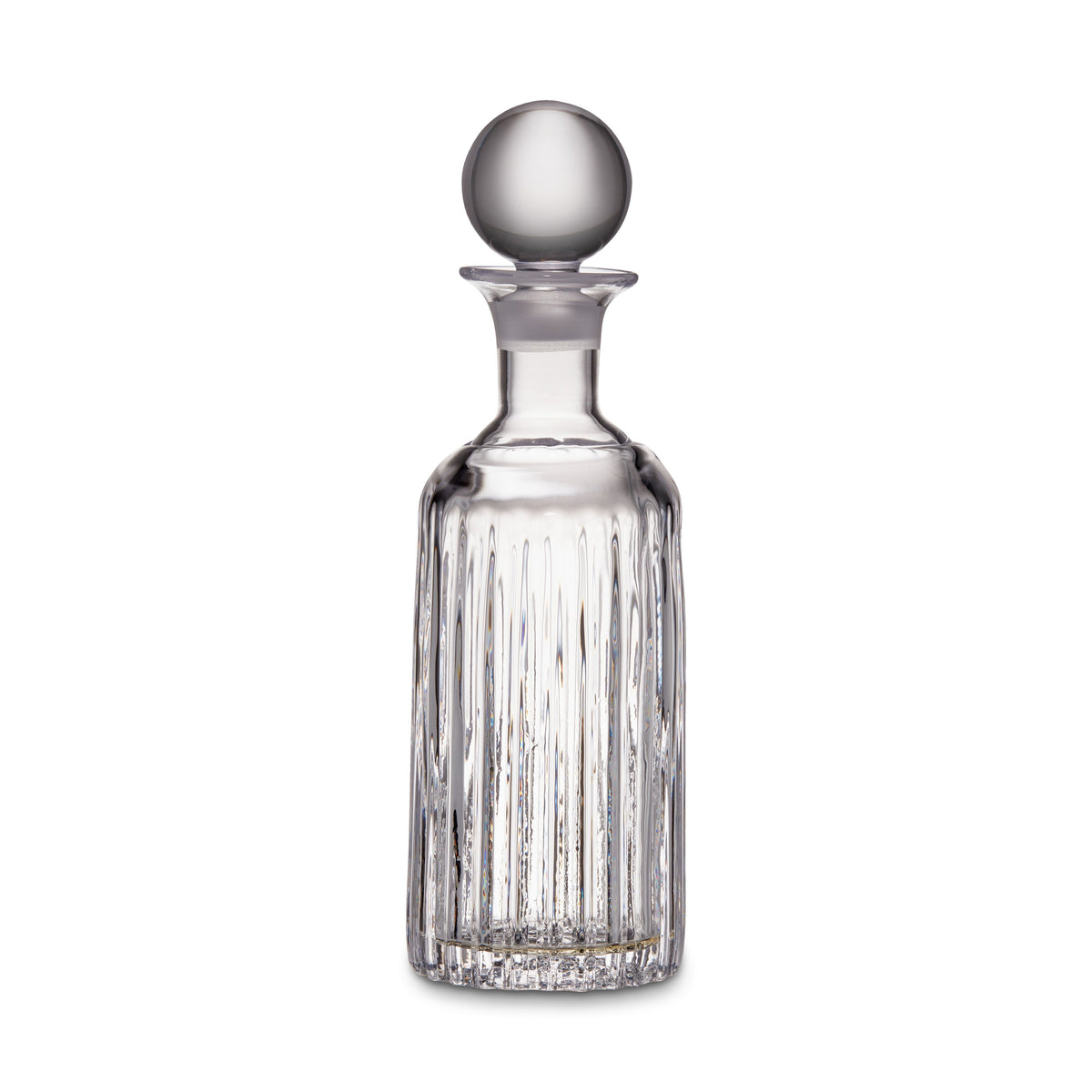 Clear glass decanter with vertical ribbed pattern and spherical stopper on white background.