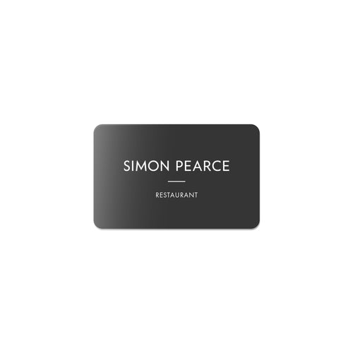 Dark gray rectangular gift card with rounded corners displaying "SIMON PEARCE" and "RESTAURANT" in white text.
