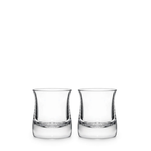 Two clear glass whiskey glasses with curved sides and weighted bases, each partially filled with clear liquid.