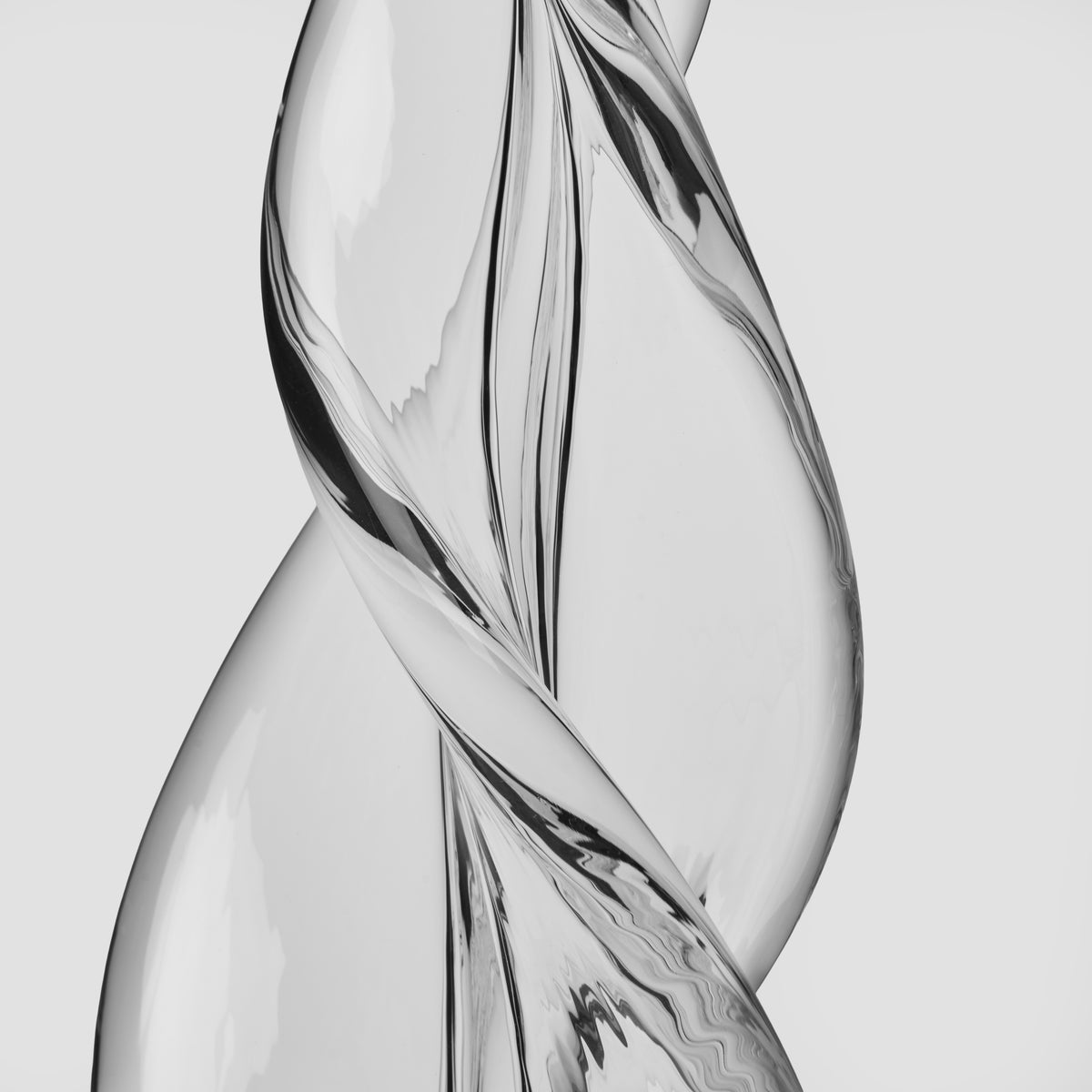 Spiral three-sided clear glass tree with twisted design, 20 inches tall, displayed against white background.