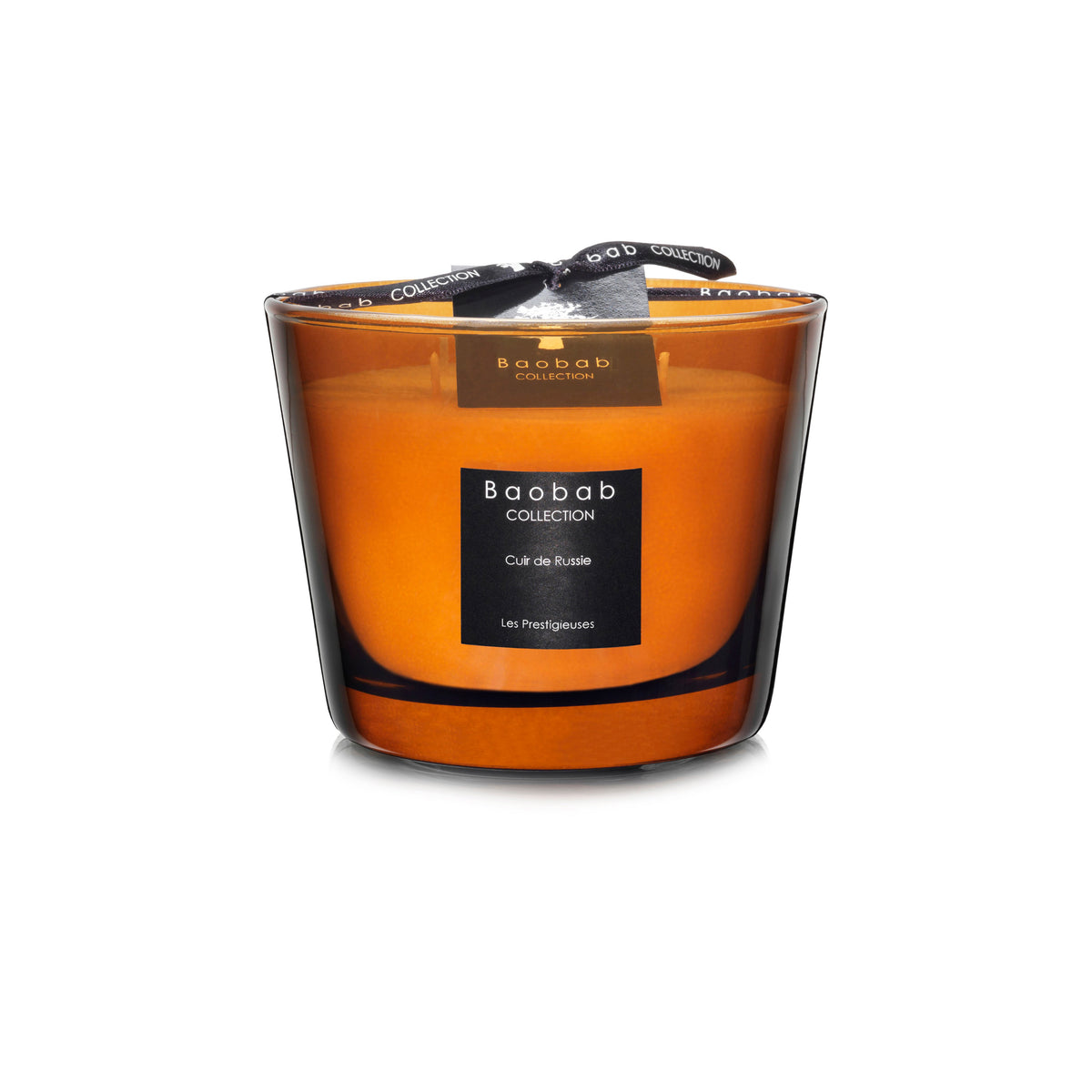 Baobab Collection Cuir de Russie candle in orange glass vessel with black label and ribbon bow.