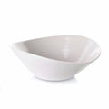 White ceramic bowl with asymmetrical oval shape and curved sides.