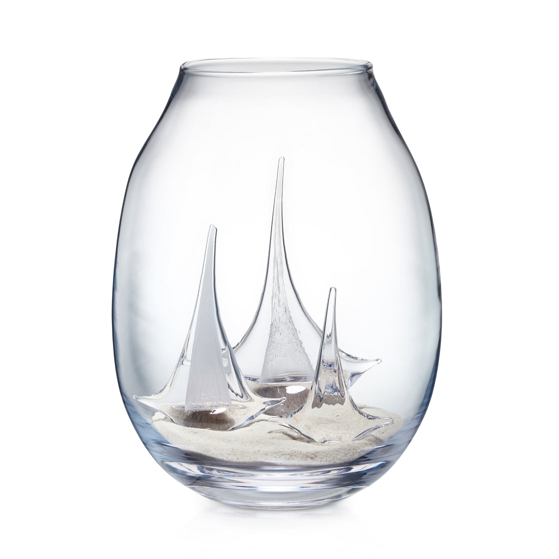 Clear glass globe vase with three etched sailboats and sand at the bottom.
