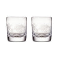 Two clear double old-fashioned glasses with engraved pine needle design around the upper portion.