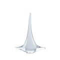 White glass sailboat with tall tapered mast and curved hull base.