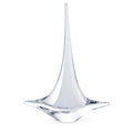 White glass sailboat figurine with tall pointed mast and curved hull base.