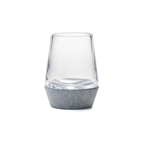 Clear glass tumbler with gray soapstone base.