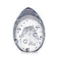 Translucent egg-shaped object filled with water and air bubbles in various sizes.
