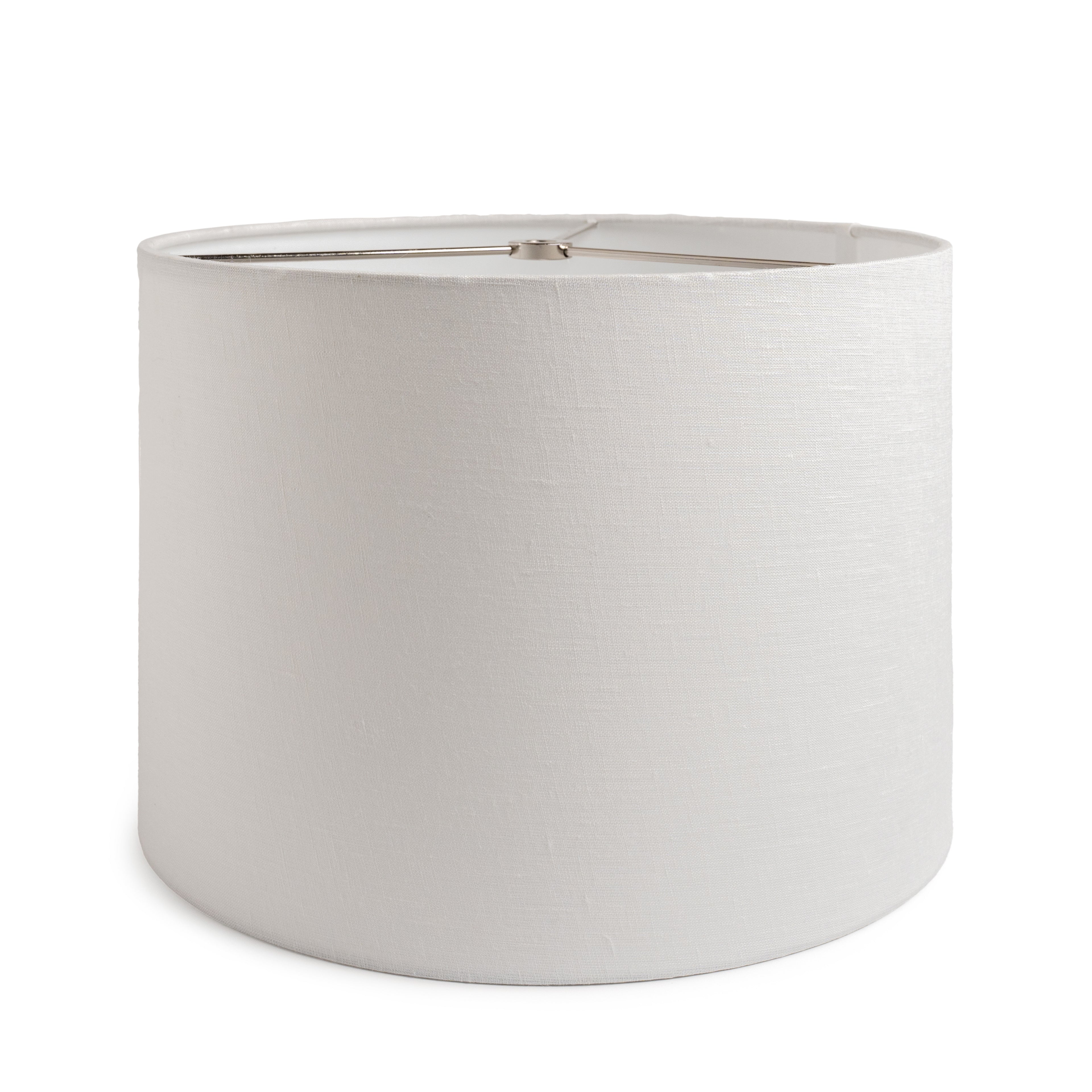 White linen barrel-shaped lamp shade with metal top ring and seam detail.