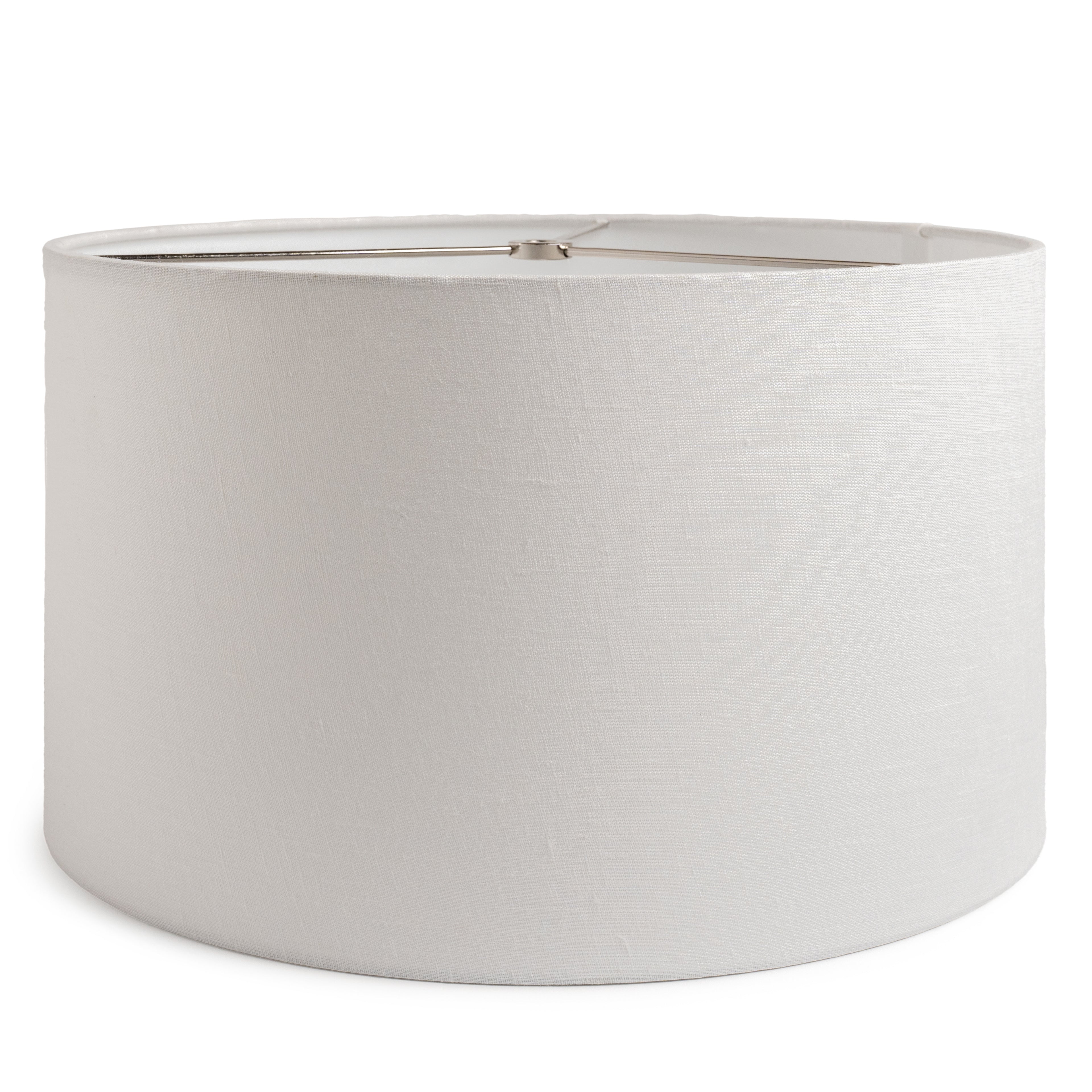 White linen barrel lamp shade with metal top ring and seam detail.