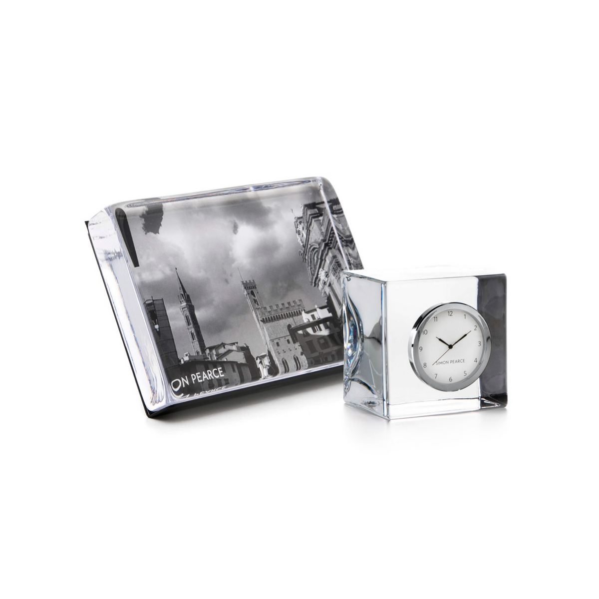 Desk set containing a black and white cityscape desk pad and a clear acrylic desk clock with chrome accents.