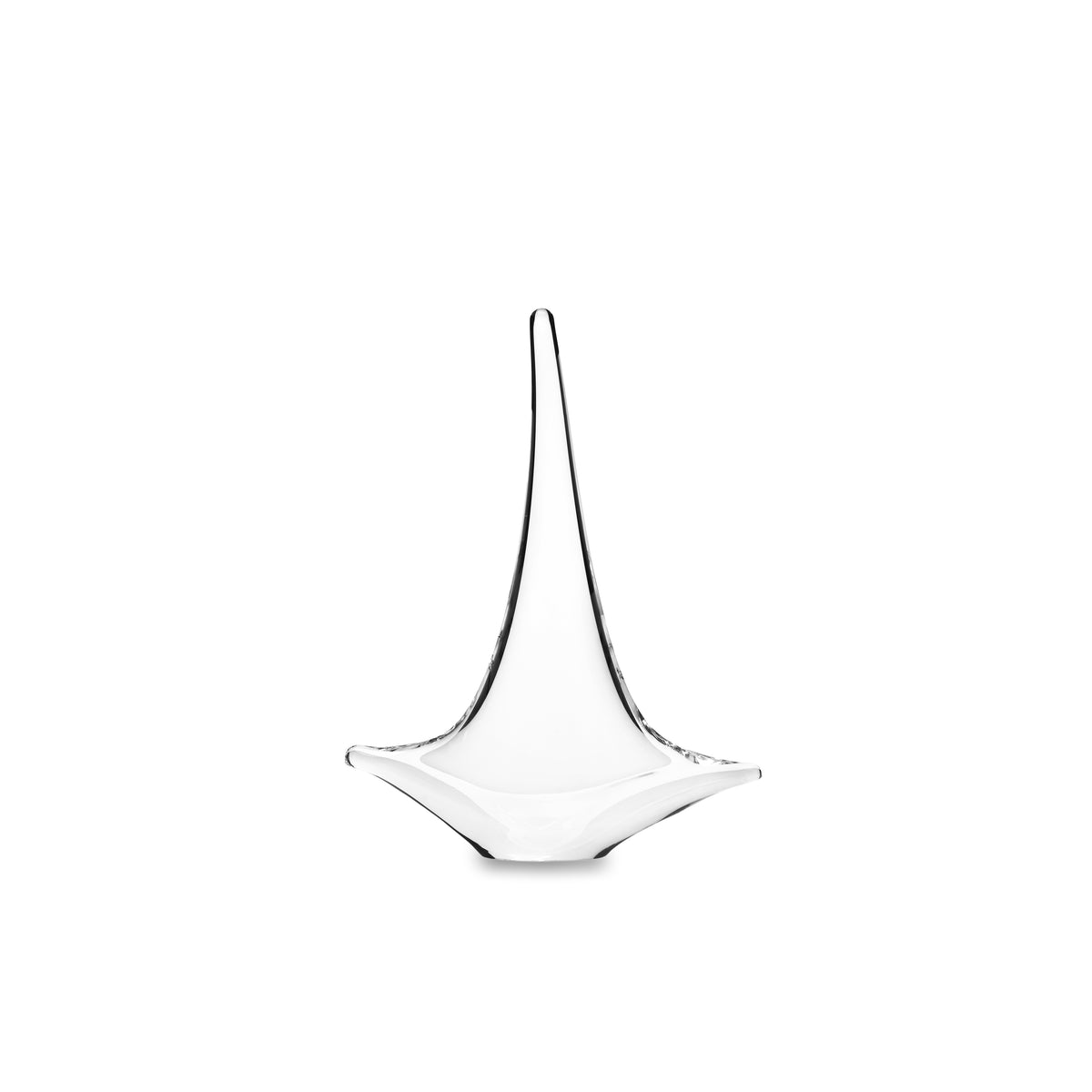 White glass sailboat sculpture with tall curved sail and wide base on white background.